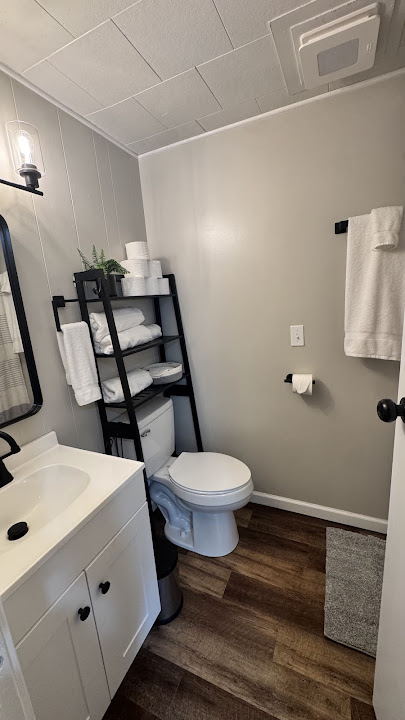 Unit 7 - Bathroom with vanity and stocked towel shelf