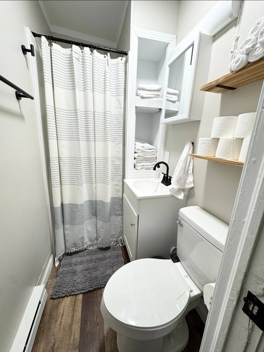 Unit 6 - Modern bathroom with stocked towels and essentials