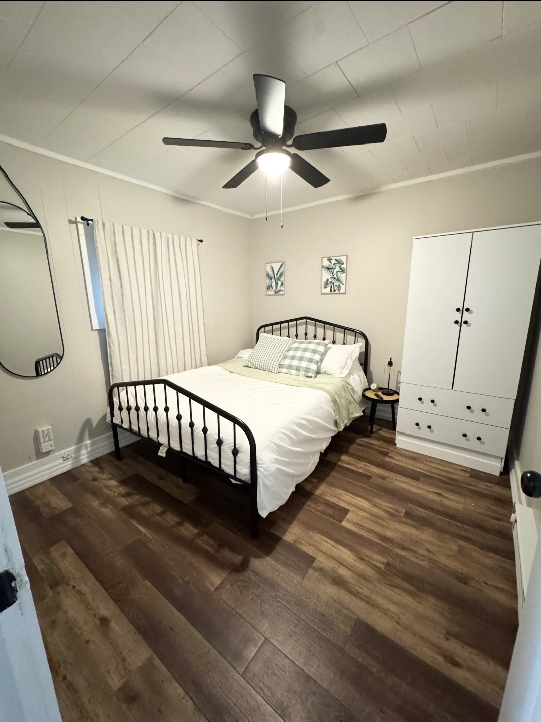 Unit 6 - Queen bedroom with wardrobe and botanical art