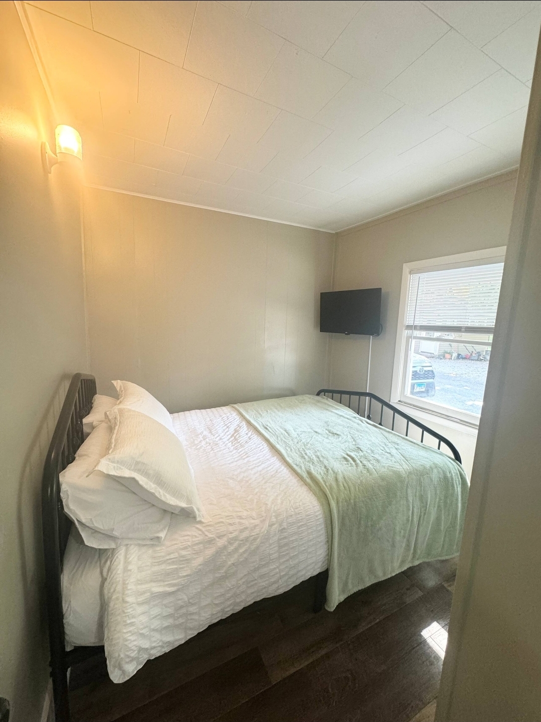 Unit 5 - Queen bedroom with TV and natural light