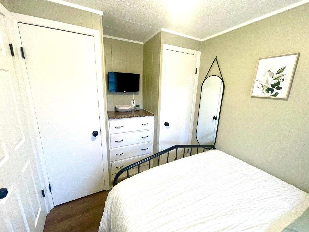 Unit 1 - Bedroom with mirror and storage