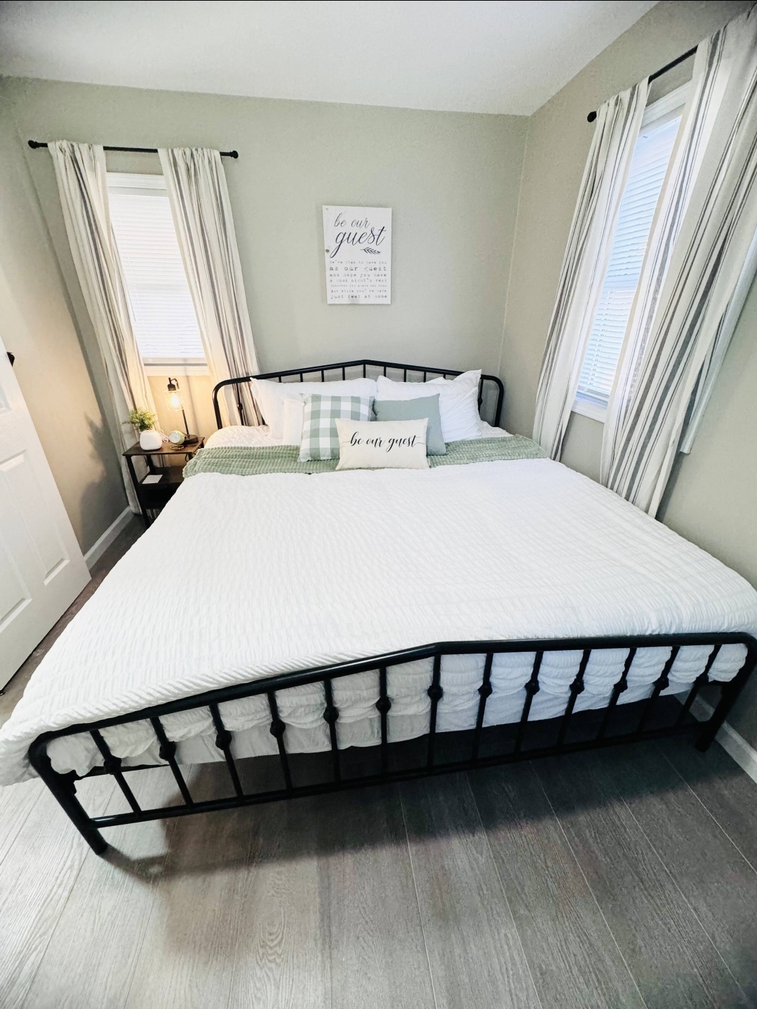 Cottage 13 - King bedroom with 'Be Our Guest' decor
