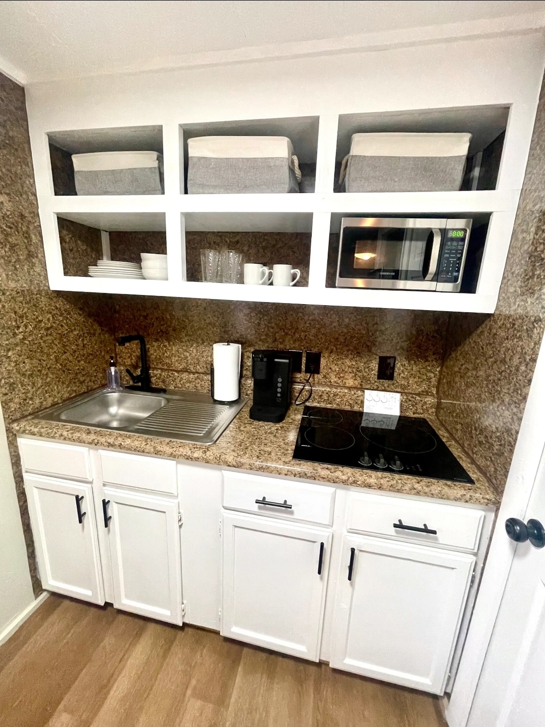 Unit 1 - Kitchen with stove, microwave, and Keurig