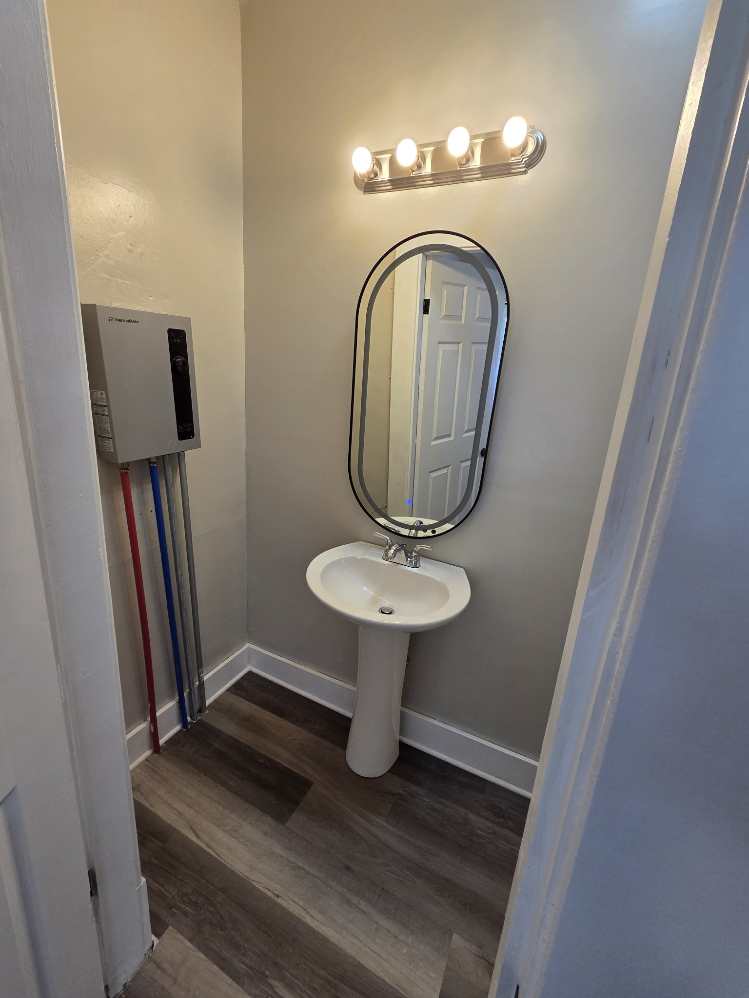 Shared Laundry - Bathroom with tankless water heater