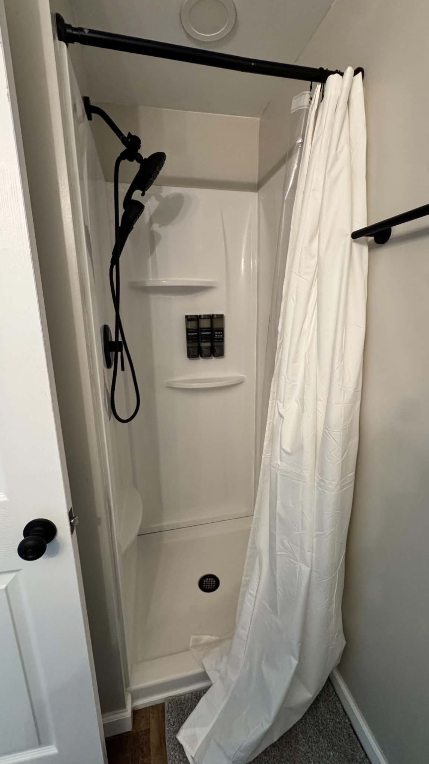 Unit 9 - Walk-in shower with toiletries